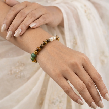Close-up of a female hand wearing a dhan yog bracelet